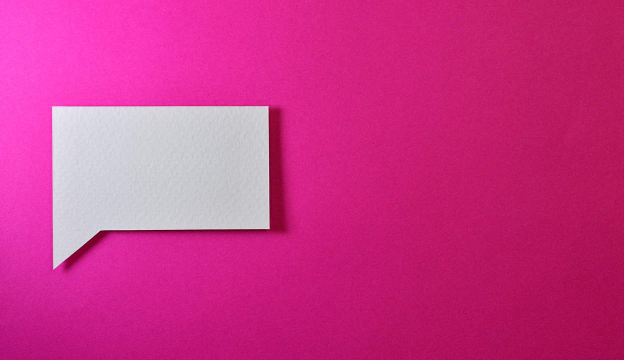 white chat icon on pink background